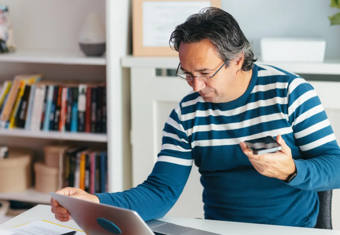 Virtual assistant working from home managing tasks on laptop.